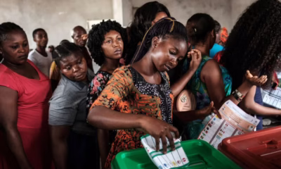 People voting at a polling station.